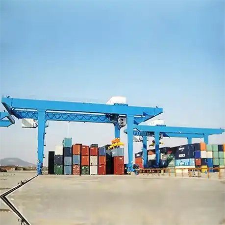 Rail-tracked port crane handling shipping containers